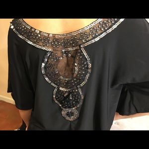 Silver sequin and black design top.